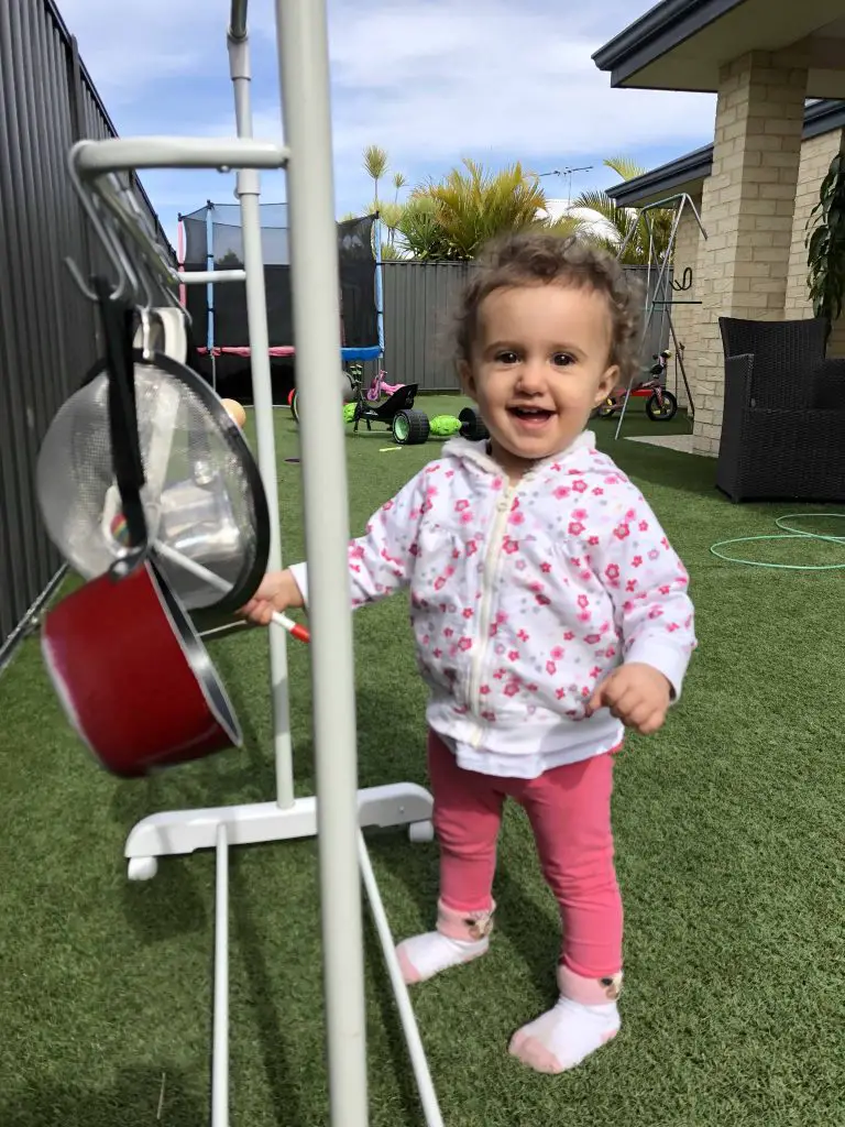 toddler with pots