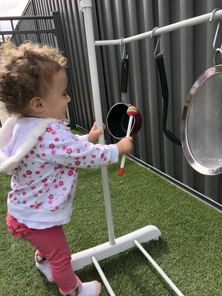 toddler hitting pots