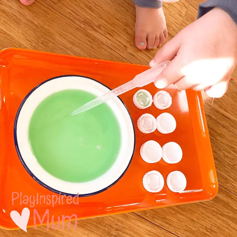 water drops in bottle tops fine motor for toddlers