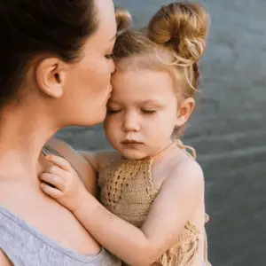 mum supporting toddler