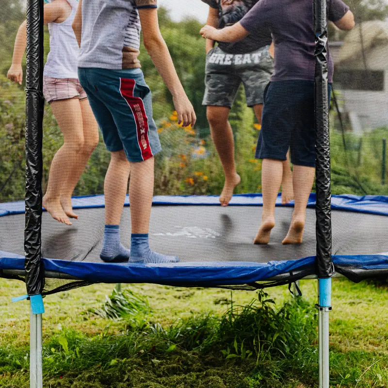 kids jumping on trampoline