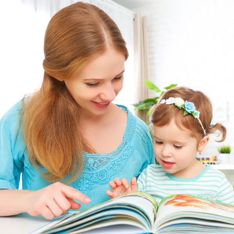 Mother and daughter reading. How children learn to read