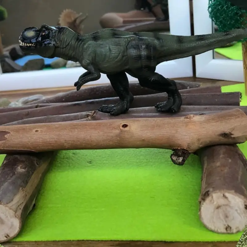 Dinosaur on logs