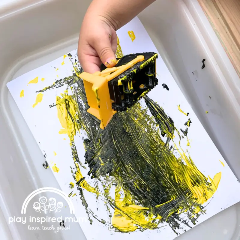 Painting with construction trucks with toddler