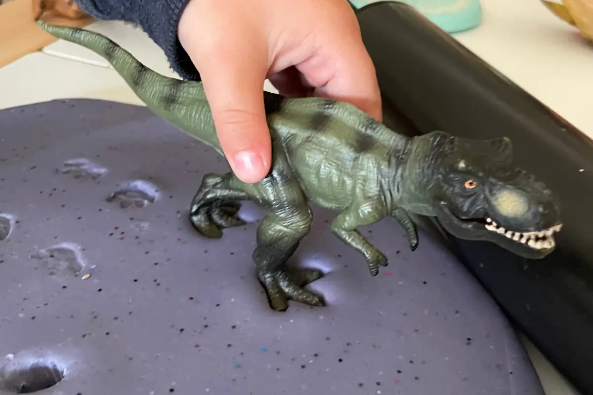 Dinosaur foot prints in play dough
