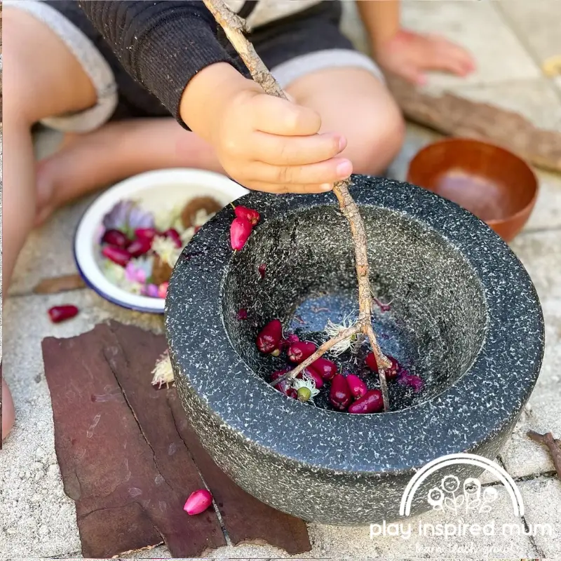 Stiring flowers mortar and pestle play