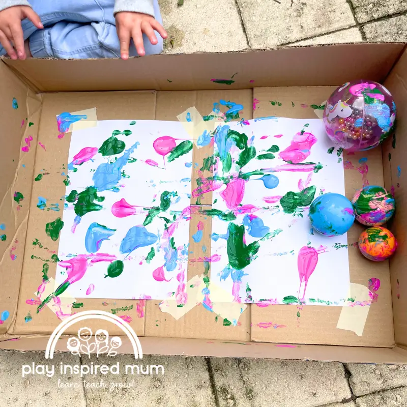toddler Painting with balls