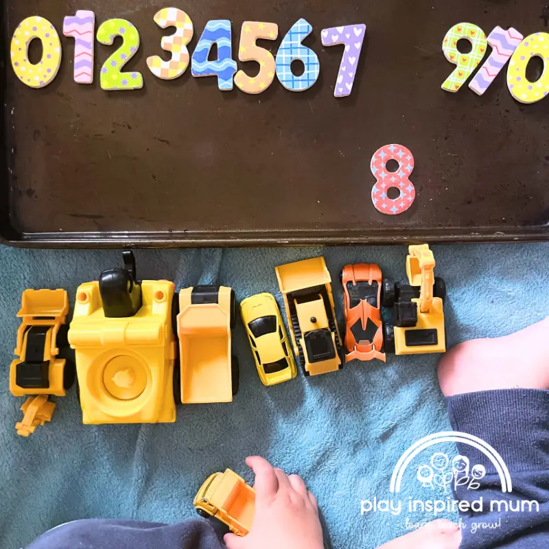 Counting trucks magnetic numbers on cookie sheet
