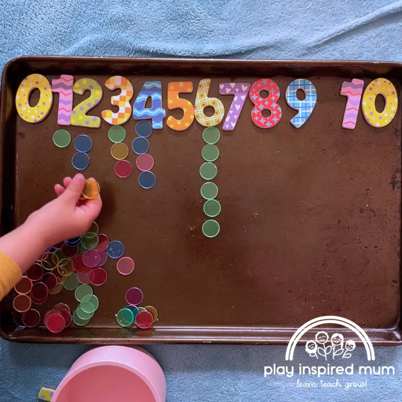 Magnetic numbers on cookie sheet counting activity