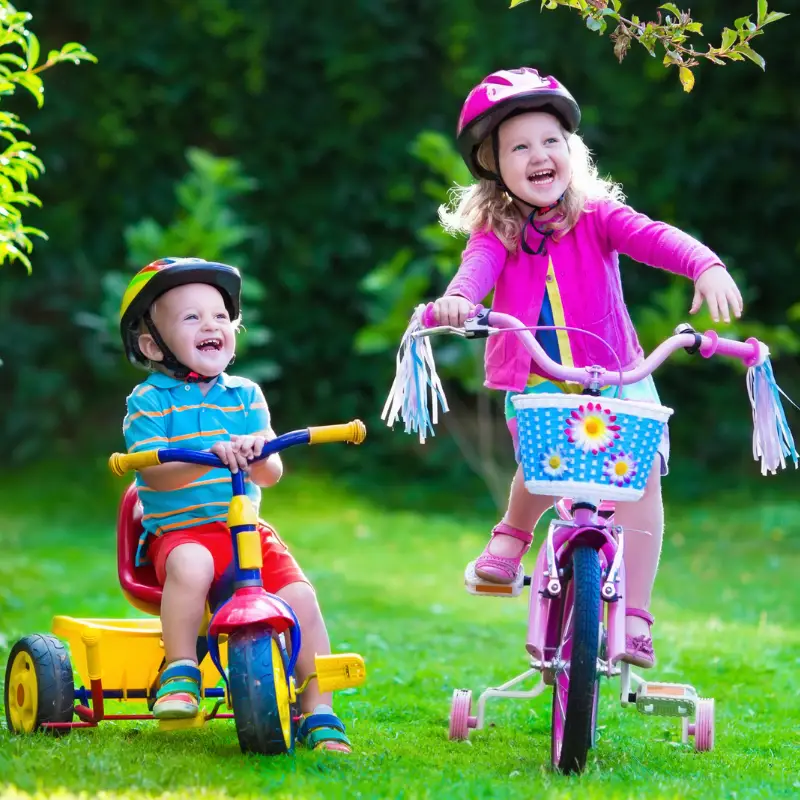 Children riding bikes wearing helmets