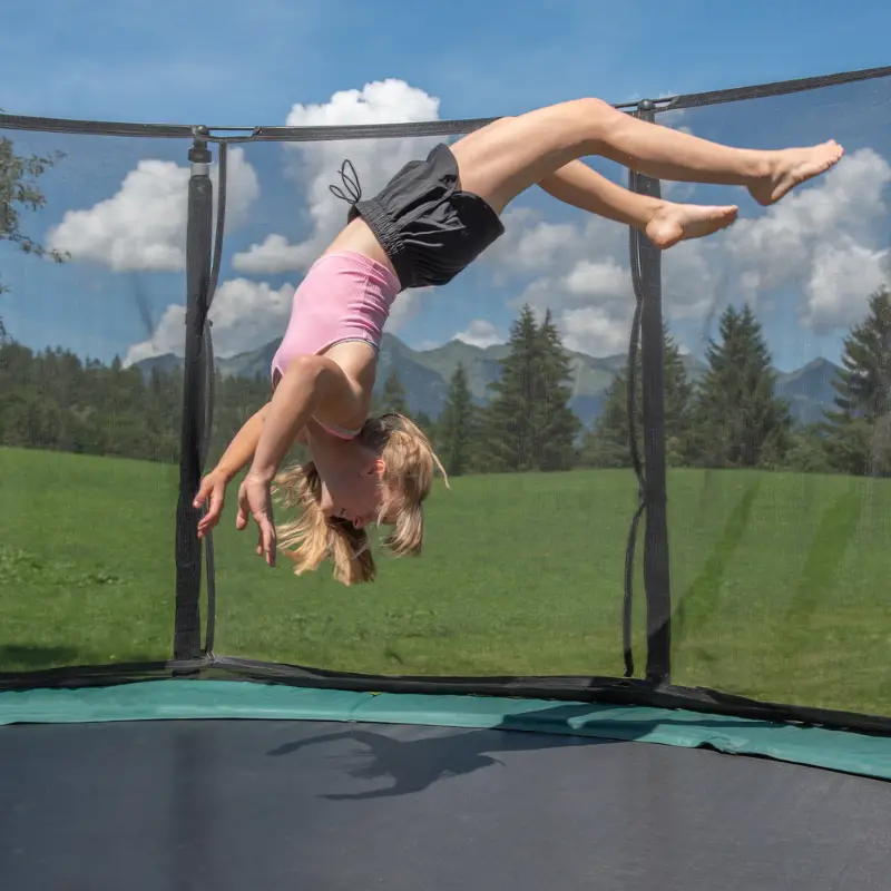 girl flipping on trampoline