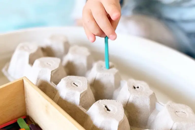 Fun with Mini Popsticks: an Egg Carton Posting Game for Toddlers