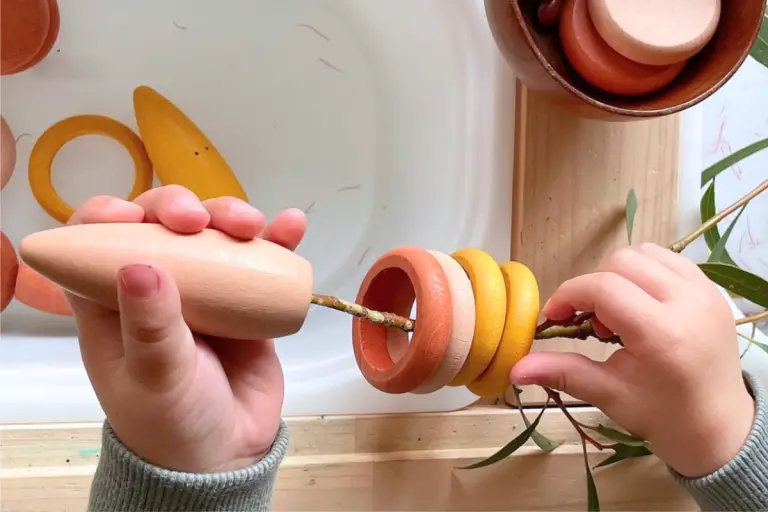 Natural Play: Threading Wooden Rings on Branches