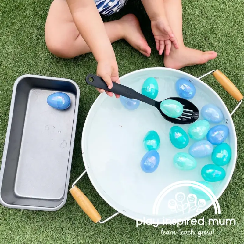 Plastic egg water play scooping and transferring