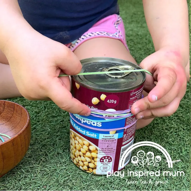 rubber bands on cans fine motor skills