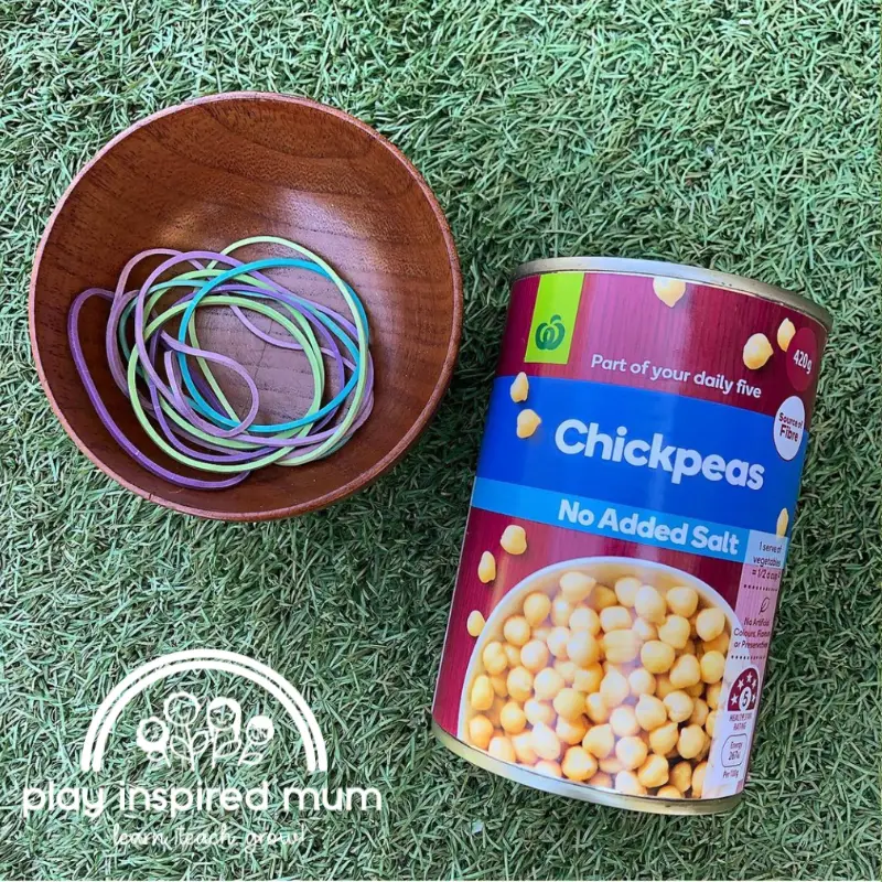 rubber bands on cans fine motor skills activity