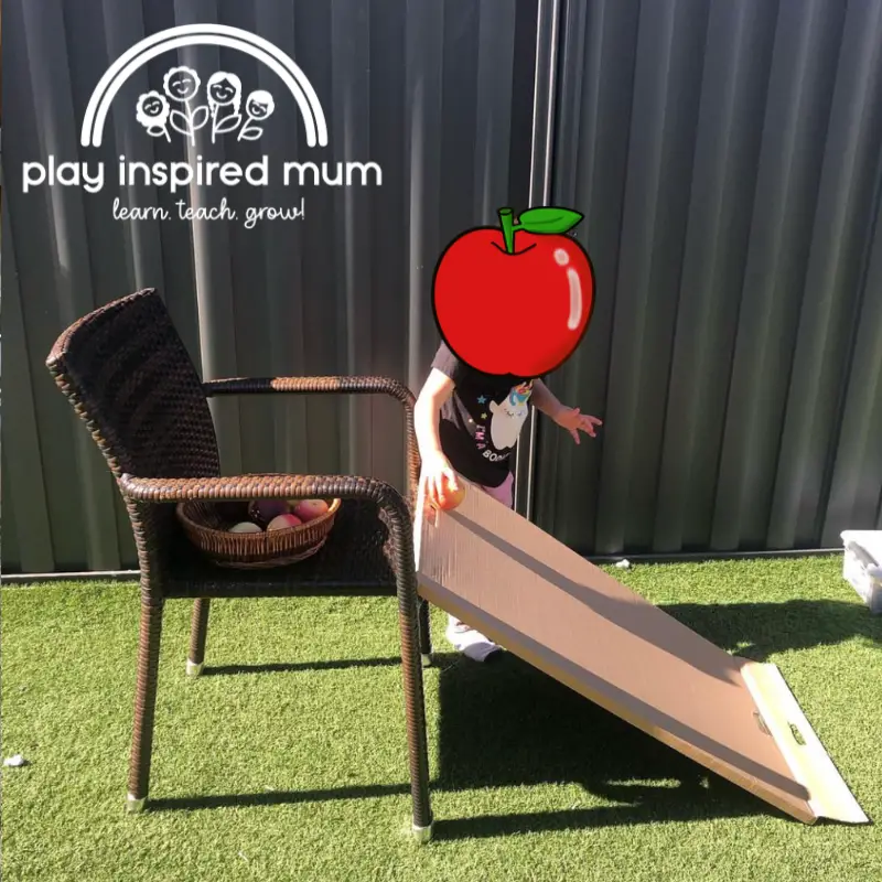 apple rolling cardboard ramp